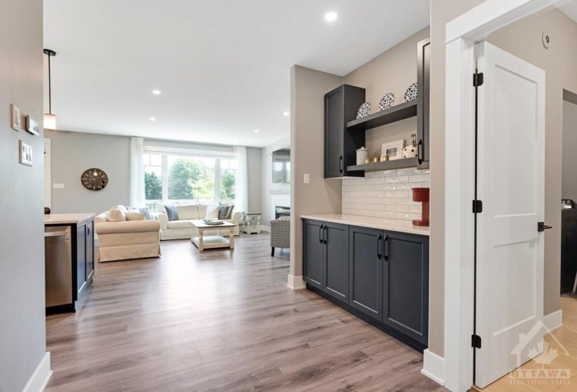 Light-filled spaces with pot lights and Butler's pantry