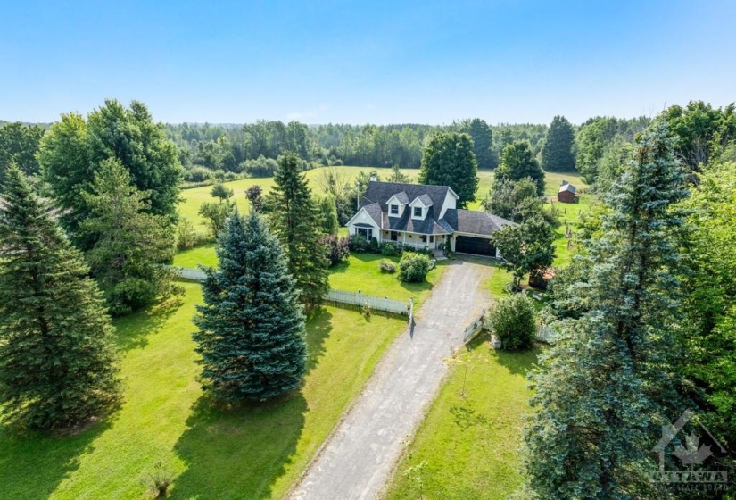 Picturesque 11 acre hobby farm with large family home set back from road, behind white picket fence