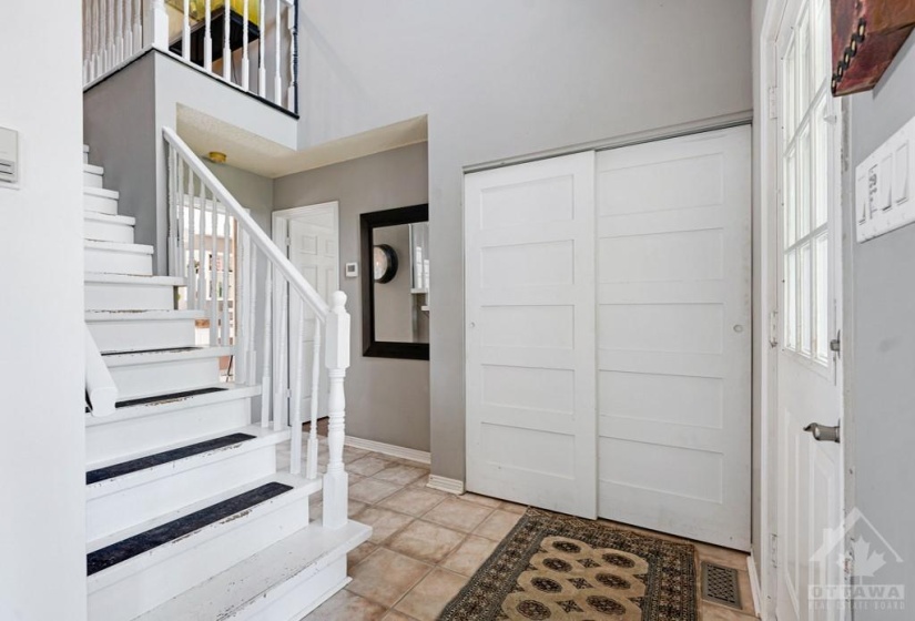 Front foyer has 16' high cathedral ceiling and double closet