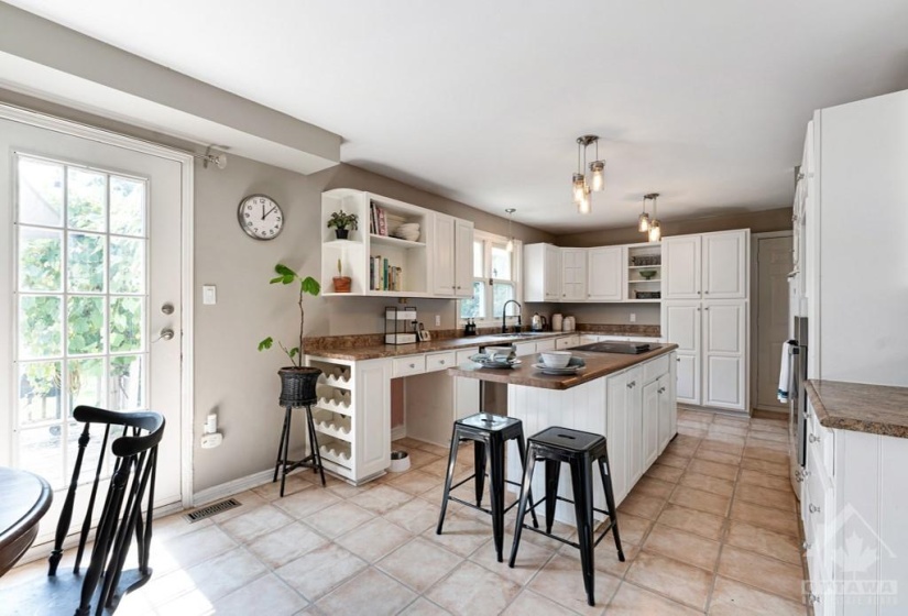 White, bright kitchen with island-breakfast bar