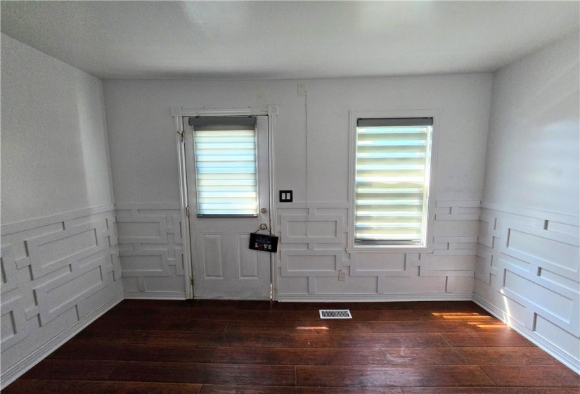 The bonus room at the back of the house has a back door leading to the back porch and back yard.