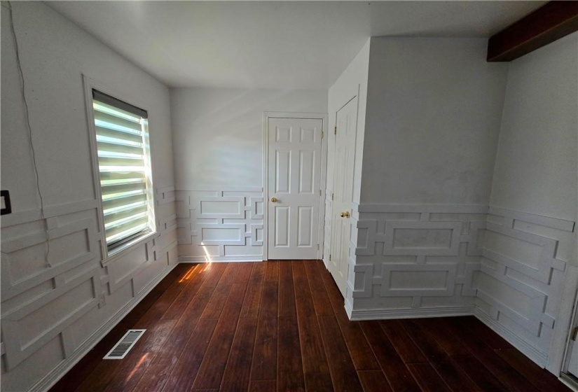 There is a lovely bonus room off the kitchen which could be den, office of guest room. It features a one piece wash room and closet for storage.