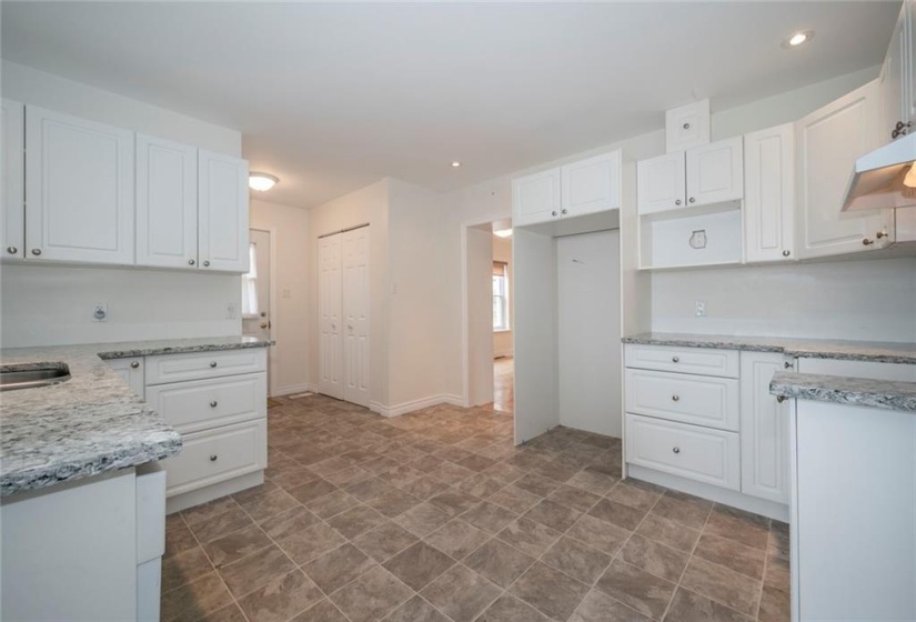 Modern kitchen with entrance on right to living room