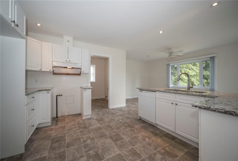 Modern Kitchen with entry door to laundry /powder room