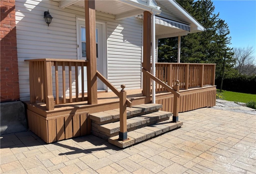 Side Entrance and deck leading to patio doors