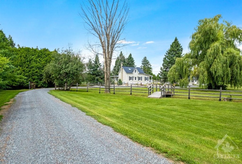 Driveway leads to quiet picturesque setting for country estate