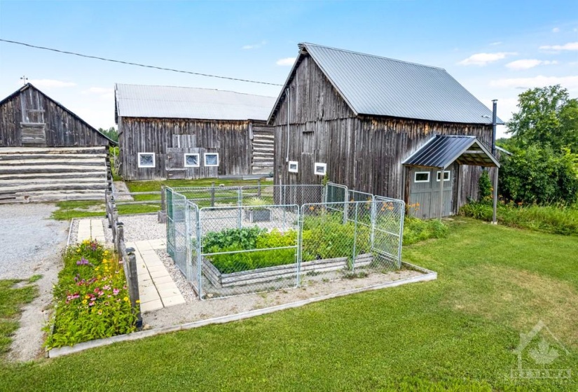 Several outbuildings including horse barn and workshop with concrete polished floor, 100 amps and 2023 propane furnace