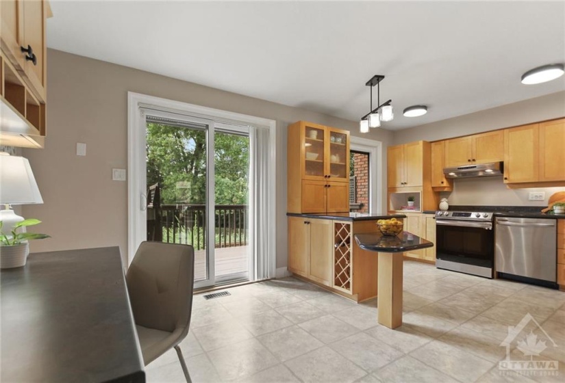 The chef in you will delight with this updated custom wood kitchen, featuring pots & pans drawers, peninsula, wine rack, glass door display cabinets, stainless steel appliances and luxurious granite countertops.