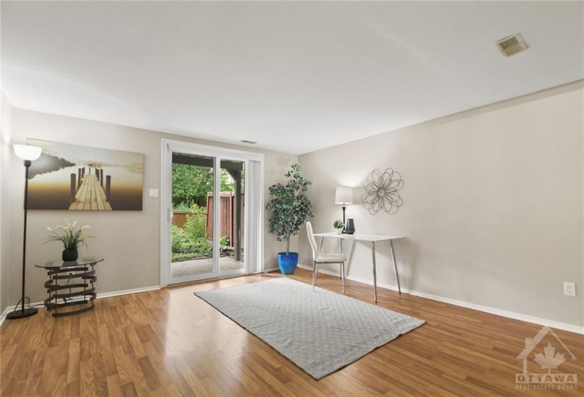 Main level family room walks out to terrace and garden oasis.