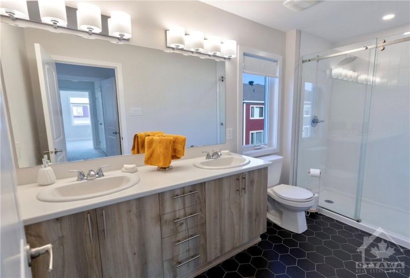 Ensuite with double sinks and honeycomb tile