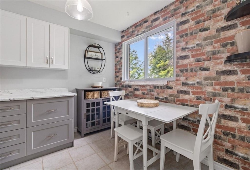 Eating area with faux brick accent wall