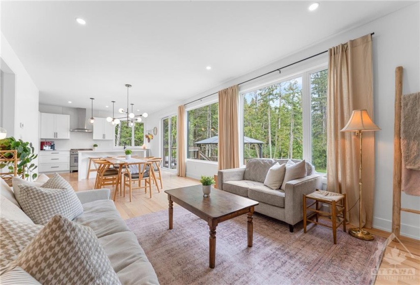 Spacious Living Room open to the Dining Room w/Wall-to-wall windows