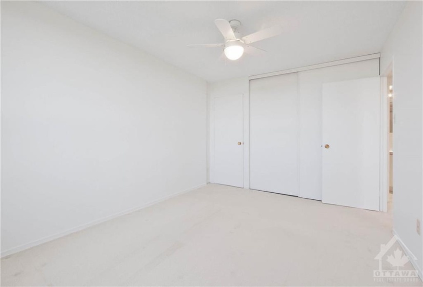 Primary Bedroom with good size closet plus a walk-in closet.  Note ceiling fan light.