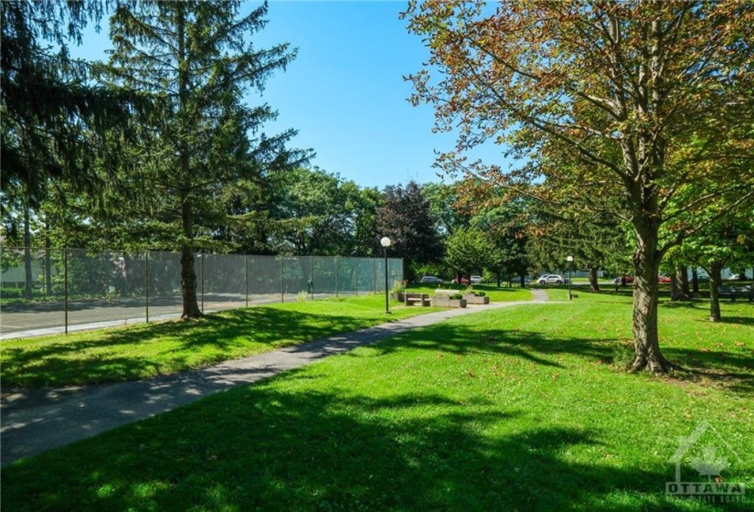 Relax with a book on the park benches on the condo grounds.