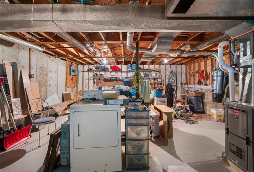 Large storage/utility room.  To the left and not shown is a massive cold storage room