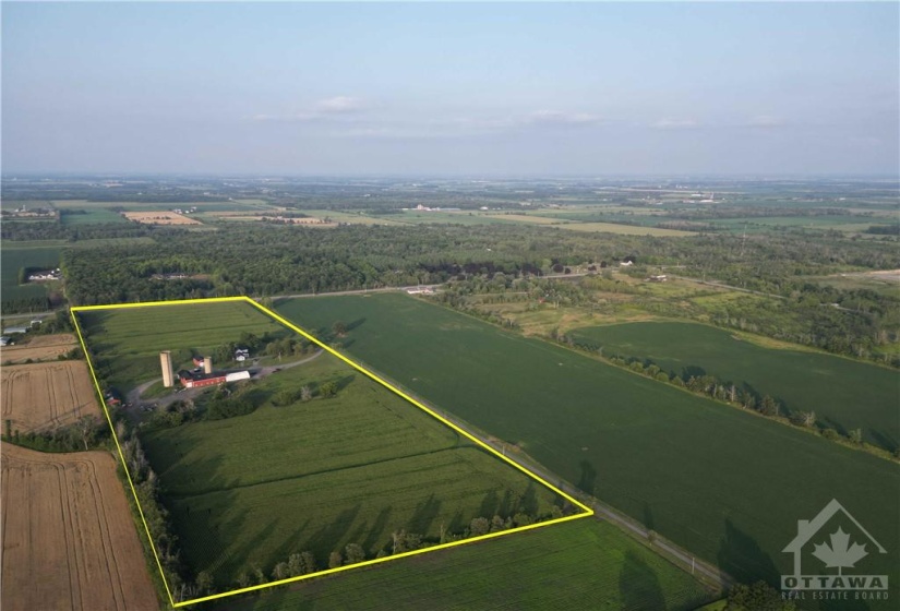 31 acres with home and outbuildings looking East to Bank St