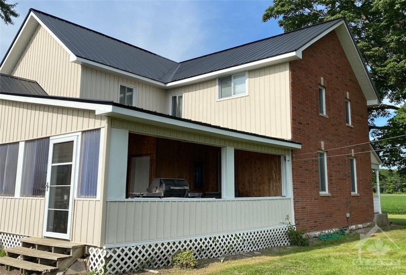 Rear entrance/porch can be screened in .