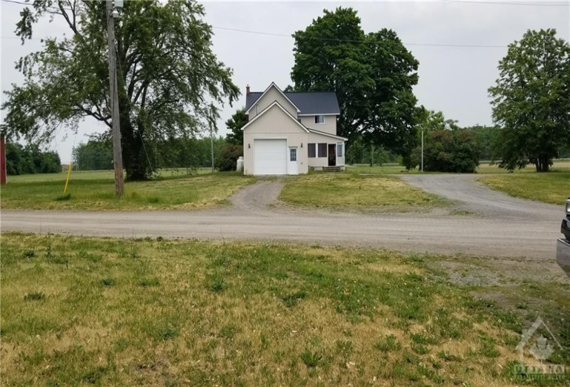 Attached garage with overhead storage and inside access to rear entrance.