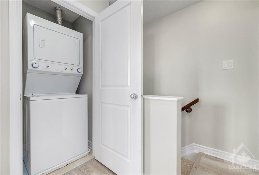 Convenient in-unit  laundry at the upper level