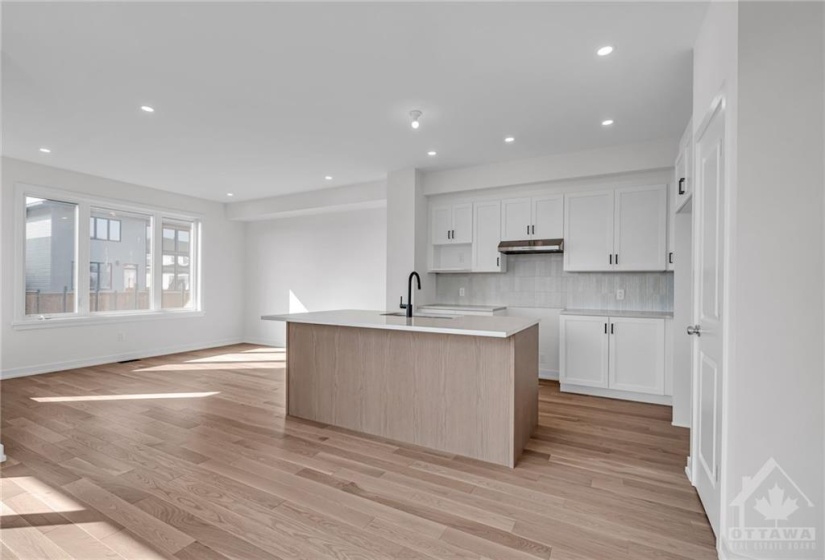 Kitchen with large island and bar style seating