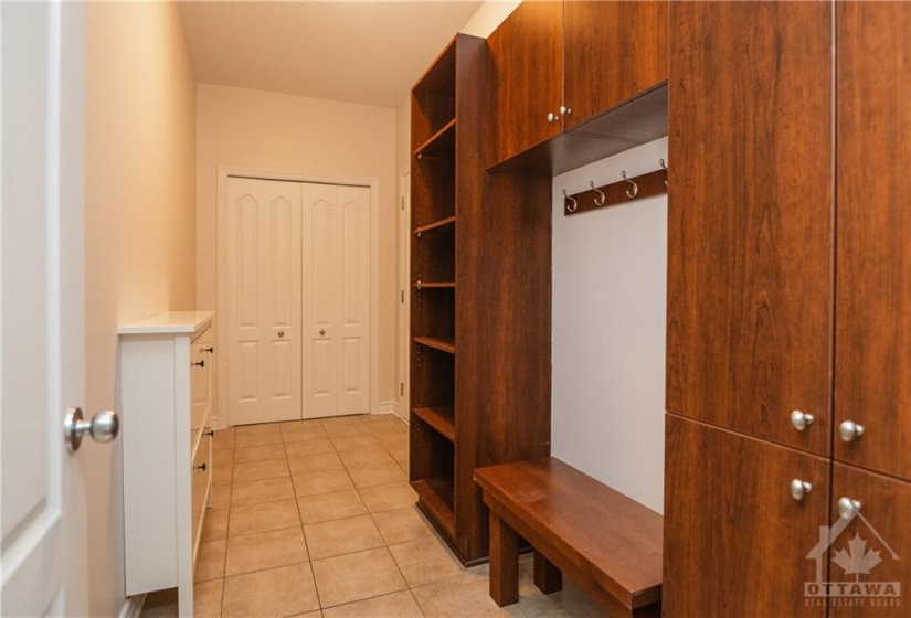 Mudroom from garage, with double closet and built-in storage. This space is dedicated to mudroom. Laundry is upstairs