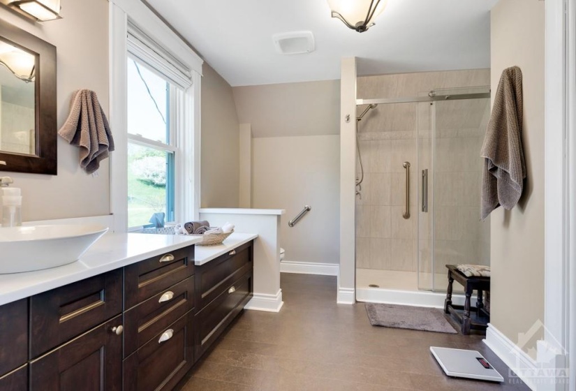 Second floor bathroom with porcelain tiled shower