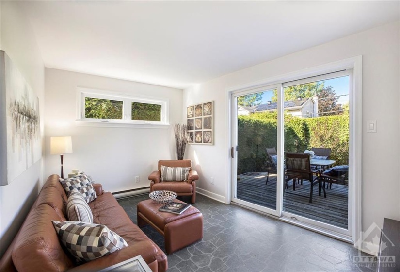 Main floor family room with access to the deck and yard.