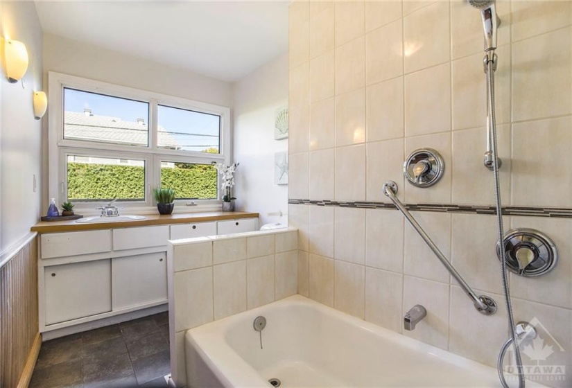 Main floor bathroom separates the kitchen and dining