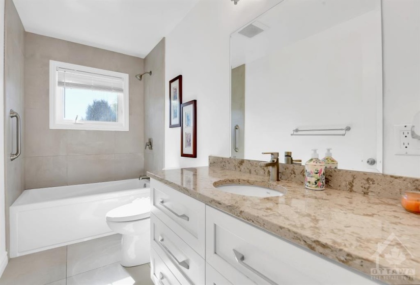 Updated main bath with granite countertop