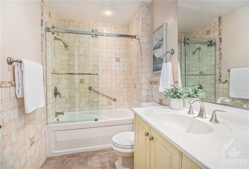 Gorgeous tile in this updated main bathroom