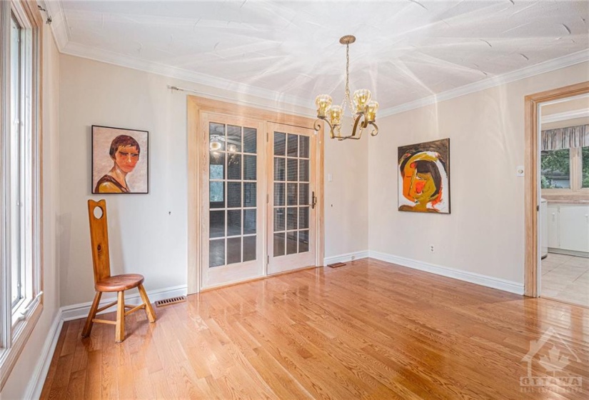 Large formal dining room leads to expansive screened in porch