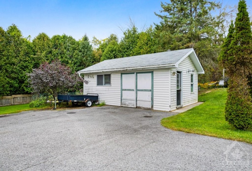 Detached finished garage-workshop has 40 amps, propane heater, wall AC and roof shingles 2019