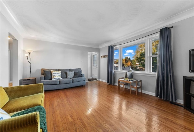 Living room with space for the adults and children. Hall left leads to 2 bedrooms and main bath.