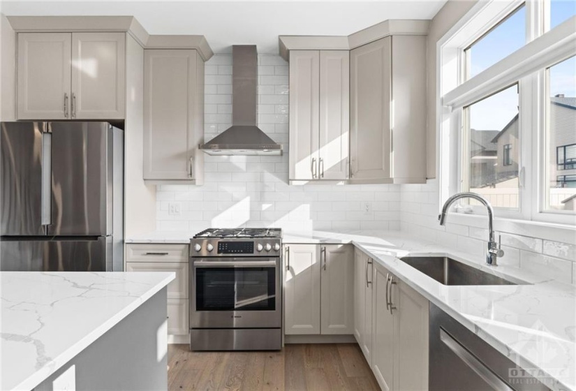 All stainless steel appliances in this chef inspired kitchen.