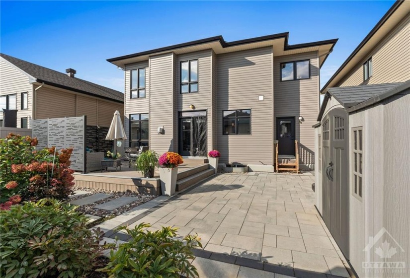 Beautiful interlock patio space w/ outdoor storage shed.