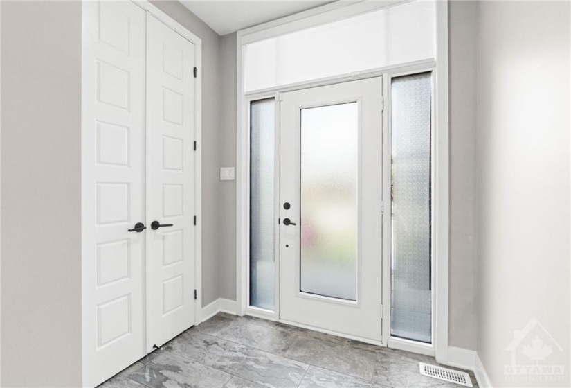 Tiled front foyer w/ double closet.