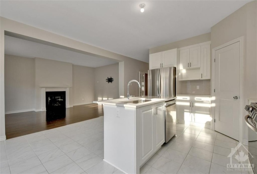 KITCHEN POV OF FAMILY RM