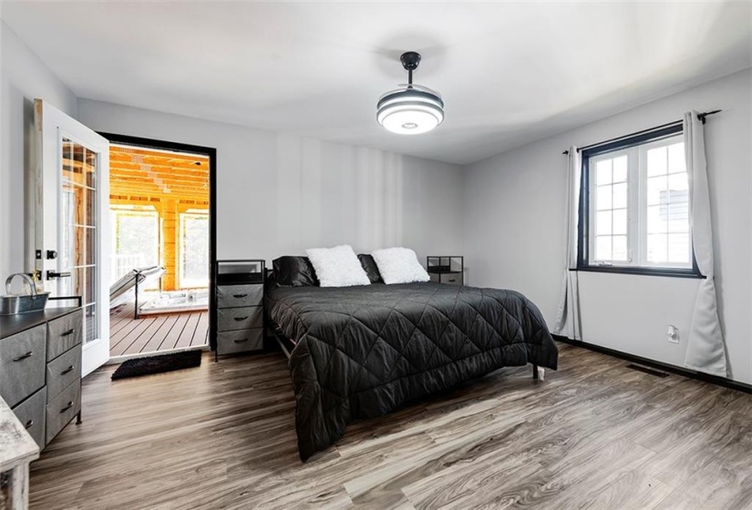 Primary bedroom and sunporch with hot tub.