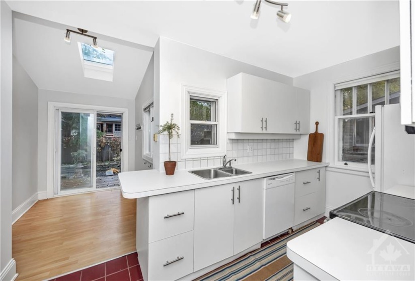 Rare eat in kitchen flooded with natural light.