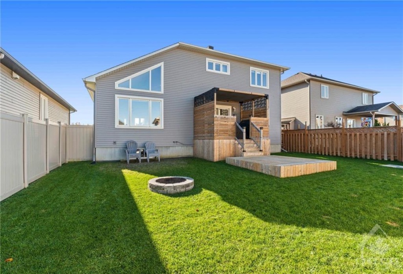 Enjoy the privacy of your fully fenced backyard, featuring a fire pit and Toja pergola.