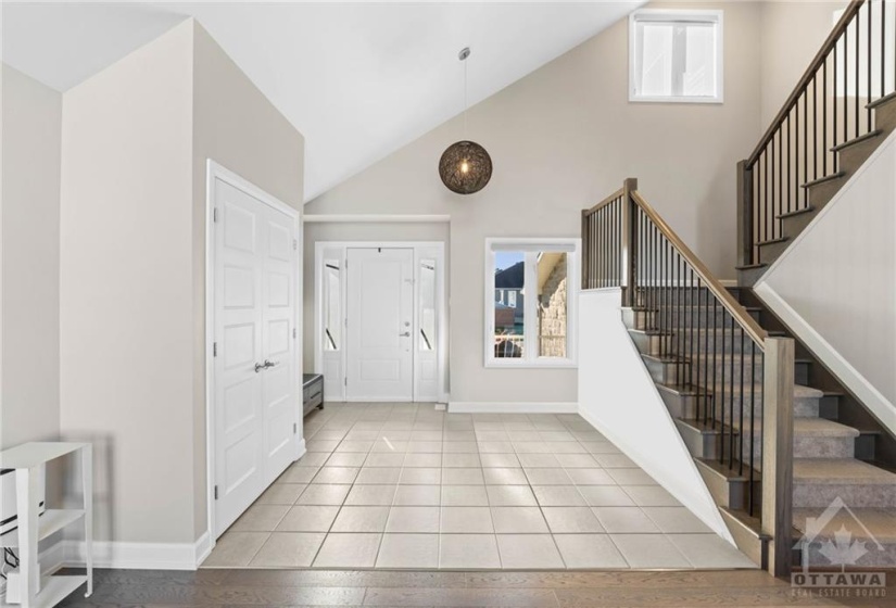 Enter through the main door into the foyer that overflows with natural light.