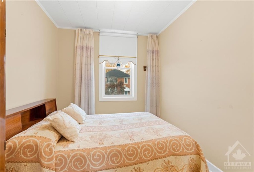 Bedroom w/ window facing Currell Ave.