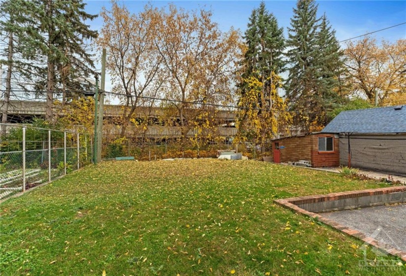 Fully fenced yard w/ no rear neighbours and outdoor storage shed.