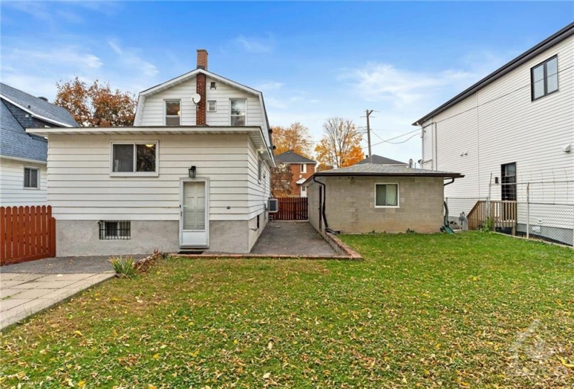 Interlock patio and driveway all the way to the rear of the home.