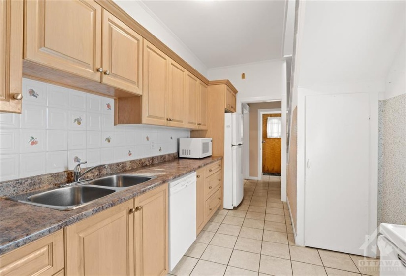 Double sink & deep pantry cupboard.