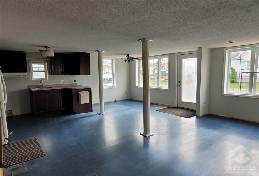 The main level is one large room.. Front door, kitchen, eating area and living room area.