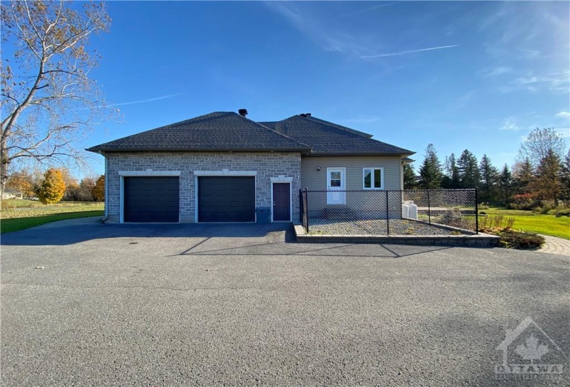 2 car oversized garage beside dog run