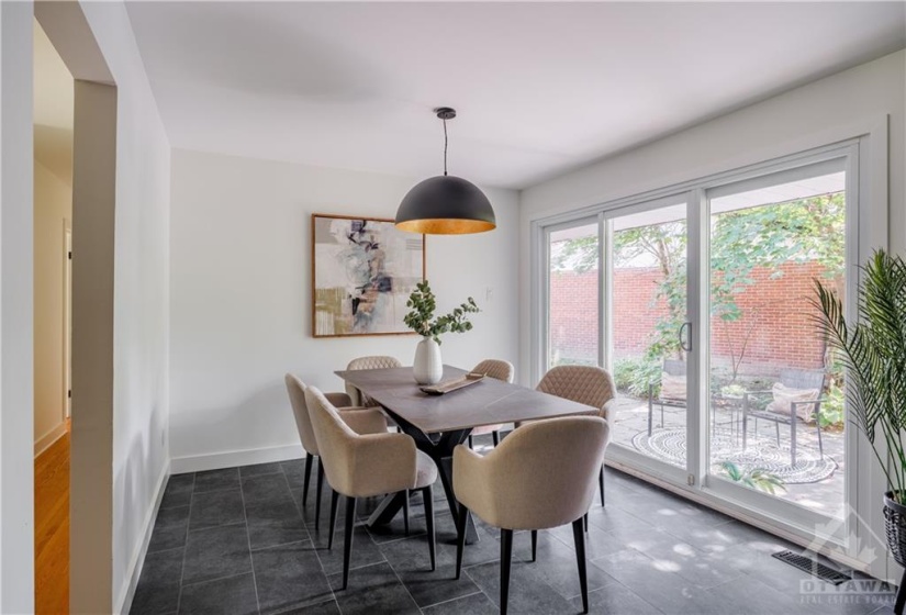 Open Concept Dining Room off Kitchen with Large Patio Doors for Tons of Natural Light!