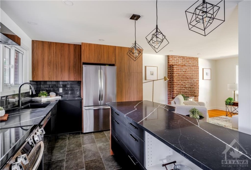 View of Kitchen and Living Room - Modern Quartz Counters with Character! Imagine Cozy evenings Cooking with a Wood Fire on!