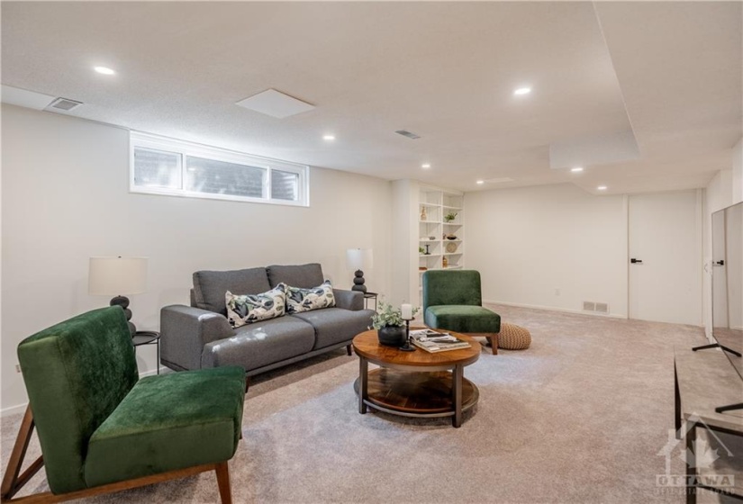 Bright Finished Basement with Custom Book Shelf!